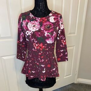 Isaac Mizrahi, floral, peplum top with 3/4 sleeves. Size XS